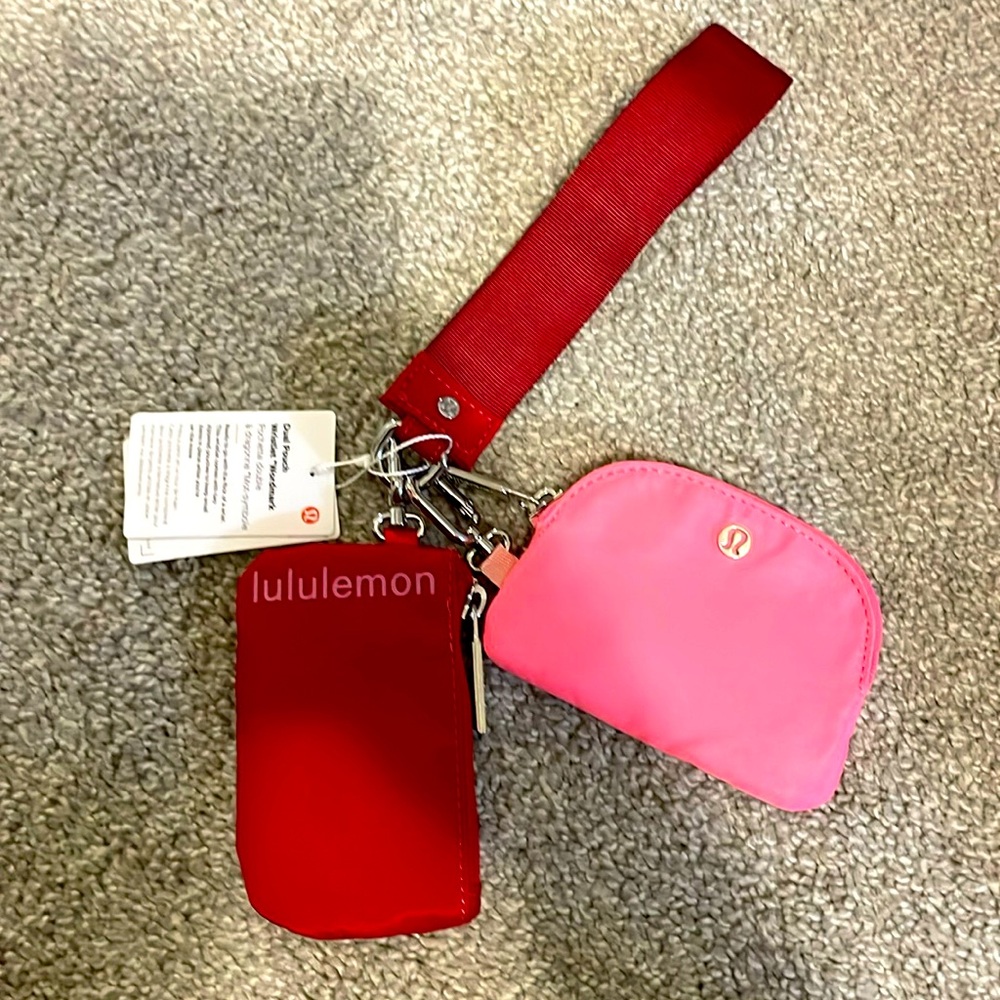 New with tags lululemon dual pouch wristlet in red and pink